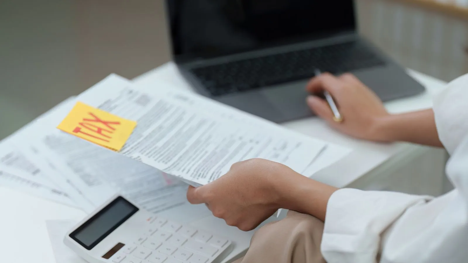 CPA reviewing tax documents with a business client