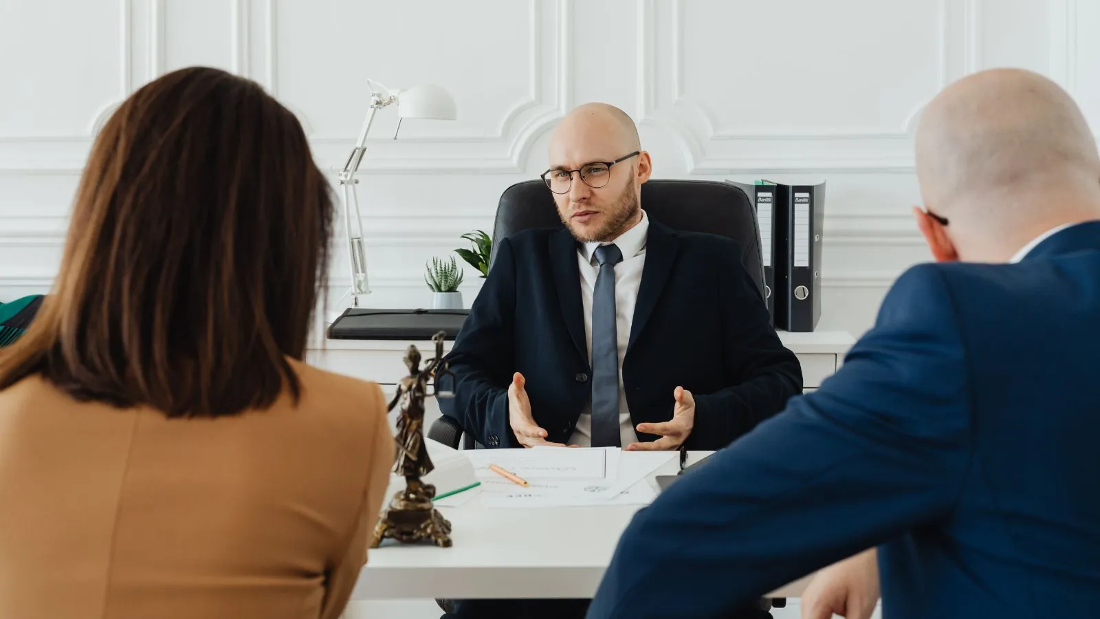 Family law attorney discussing a case with a client in a professional office
