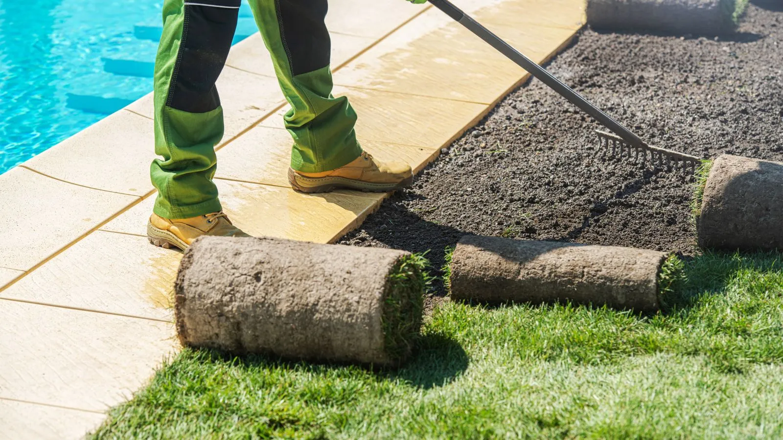 Landscaping crew installing a premium patio and lawn